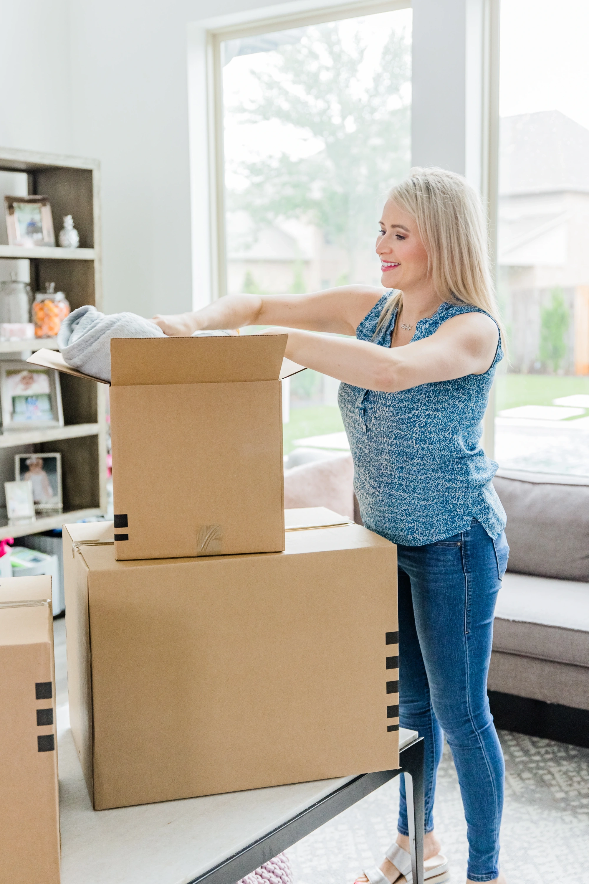 Woman packing boxes